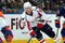 UNIONDALE, NY - OCTOBER 24:  Mike Green #52 of the Washington Capitals skates against Matt Moulson #26 of the New York Islanders on October 24, 2009 at Nassau Coliseum in Uniondale, New York. The Capitals won the game 3-2 in overtime.  (Photo by Jim McIsaac/Getty Images)