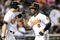 BALTIMORE - AUGUST 31:   Melvin Mora #6 of the Baltimore Orioles is congratulated by Luke Scott #30 after hitting a home run in the eighth inning against the New York Yankees on August 31, 2009 at Camden Yards in Baltimore, Maryland.  (Photo by Greg Fiume/Getty Images)