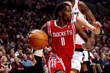 PORTLAND, OR - OCTOBER 27:  Aaron Brooks #0 of the Houston Rockets drives against the Portland Trail Blazers during the season opener on October 27, 2009 at the Rose Garden in Portland, Oregon. NOTE TO USER: User expressly acknowledges and agrees that, by downloading and or using this Photograph, user is consenting to the terms and conditions of the Getty Images License Agreement.  (Photo by Jonathan Ferrey/Getty Images)
