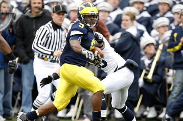 ANN ARBOR, MI - OCTOBER 24: Martavious Odoms #9 of the Michigan Wolverines tries to get around the tackle of Nick Sukay #18 of the Penn State Nittany Lions on October 24, 2009 at Michigan Stadium in Ann Arbor, Michigan. Penn State won the game 35-10. (Photo by Gregory Shamus/Getty Images)