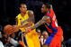 LOS ANGELES, CA - OCTOBER 27:  Shannon Brown #12 of the Los Angeles Lakers looks to pass against Rasual Butler #45 of the Los Angeles Clippers during the season opening game at Staples Center on October 27, 2009 in Los Angeles, California.  The Lakers won 99-92.  NOTE TO USER: User expressly acknowledges and agrees that, by downloading and or using this photograph, User is consenting to the terms and conditions of the Getty Images License Agreement. Mandatory Copyright Notice: Copyright 2009 NBAE  (Photo by Kevork Djansezian/Getty Images)