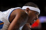 DENVER - OCTOBER 28:  Carmelo Anthony #15 of the Denver Nuggets looks on while awaiting a free throw against the Utah Jazz during NBA action at Pepsi Center on October 28, 2009 in Denver, Colorado. The Nuggets defeated the Jazz 114-105.  (Photo by Doug Pensinger/Getty Images)