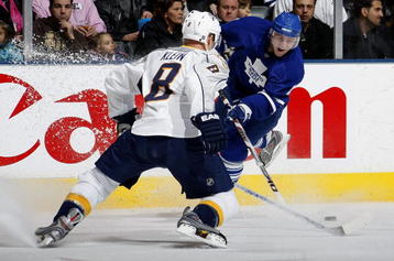 TORONTO - JANUARY 13:  Kevin Klein #8 of the Nashville Predators defends against Jiri Tlusty #11 of the Toronto Maple Leafs during their NHL game at the Air Canada Centre January 13, 2009 in Toronto, Ontario.(Photo By Dave Sandford/Getty Images)