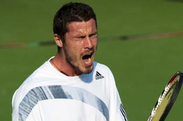 SHANGHAI, CHINA - OCTOBER 14:  Marat Safin of Russia reacts to a lost point against Tomas Berdych of the Czech Republic during day four of 2009 Shanghai ATP Masters 1000 at the Qi Zhong Tennis Centre on October 14, 2009 in Shanghai.  (Photo by Victor Fraile/Getty Images)