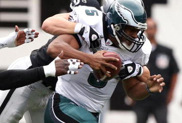 OAKLAND, CA - OCTOBER 18:   Donovan McNabb #5 of the Philadelphia Eagles is sacked by Trevor Soctt #91 of the Oakland Raiders during an NFL game at the Oakland-Alameda County Coliseum on October 18, 2009 in Oakland, California.  (Photo by Jed Jacobsohn/Getty Images)