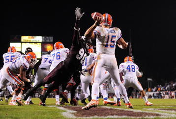 STARKVILLE, MS - OCTOBER 24:  Quarterback Tim Tebow # 15 of the Florida Gators is rushed by Pernell McPhee # 90 of Mississippi State, resulting in an interception return for a touchdown, during the second half, at Davis Wade Stadium on  October 24, 2009 in Starkville, Mississippi  (Photo by Rick Dole/Getty Images)