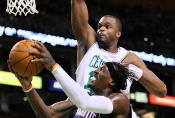 BOSTON, MA - OCTOBER 28: Shelden Williams #13 of the Boston Celtics attempts to block the shot of Gerald Wallace #3 of Charlotte Bobcats at the TD Banknorth Garden on October 28, 2009 in Boston, Massachusetts. NOTE TO USER: User expressly acknowledges and agrees that, by downloading and/or using this Photograph, user is consenting to the terms and conditions of the Getty Images License Agreement. (Photo by Jim Rogash/Getty Images)