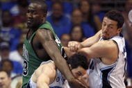 ORLANDO, FL - MAY 08:  J.J. Redick #7 of the Orlando Magic (C) is fouled by Kendrick Pewrkins #43 of the Boston Celtics (L) in Game Three of the Eastern Conference Semifinals during the 2009 NBA Playoffs at Amway Arena on May 8, 2009 in Orlando, Florida. NOTE TO USER: User expressly acknowledges and agrees that, by downloading and or using this photograph, User is consenting to the terms and conditions of the Getty Images License Agreement.  (Photo by Marc Serota/Getty Images)