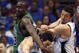 ORLANDO, FL - MAY 08:  J.J. Redick #7 of the Orlando Magic (C) is fouled by Kendrick Pewrkins #43 of the Boston Celtics (L) in Game Three of the Eastern Conference Semifinals during the 2009 NBA Playoffs at Amway Arena on May 8, 2009 in Orlando, Florida. NOTE TO USER: User expressly acknowledges and agrees that, by downloading and or using this photograph, User is consenting to the terms and conditions of the Getty Images License Agreement.  (Photo by Marc Serota/Getty Images)