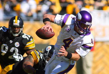 PITTSBURGH - OCTOBER 25:  Quarterback Brett Favre #4 of the Minnesota Vikings tries to break free of a tackle during the NFL game against the Pittsburgh Steelers at Heinz Field on October 25, 2009 in Pittsburgh, Pennsylvania. The Steelers defeated the Vikings 27-17. (Photo by Rick Stewart/Getty Images)