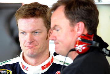 WATKINS GLEN, NY - AUGUST 07:  Dale Earnhardt Jr. (L), driver of the #88 National Guard/AMP Energy Chevrolet, talks with crew chief Lance McGrew in the garage during practice for the NASCAR Sprint Cup Series Heluva Good! Sour Cream Dips at Watkins Glen International on August 7, 2009 in Watkins Glen, New York.  (Photo by John Harrelson/Getty Images for NASCAR)