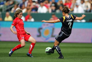 CARSON, CA - MARCH 29:  Kendall Fletcher #2 of the Los Angeles Sol plays the ball as Sonia Bompastor #8 of the Washington Freedom looks to defend the play during their inaugural WPS match at The Home Depot Center on March 29, 2009 in Carson, California. The Sol defeated the Freedom 2-0.  (Photo by Victor Decolongon/Getty Images)