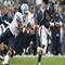 EAST HARTFORD, CT - SEPTEMBER 12: Jasper Howard #6 of the Connecticut Huskies carries the ball as Johnny White #34 of the North Carolinia Tar Heels tries to make the tackle on September 12, 2009 at Rentschler Field in East Hartford, Connecticut. (Photo by Elsa/Getty Images)