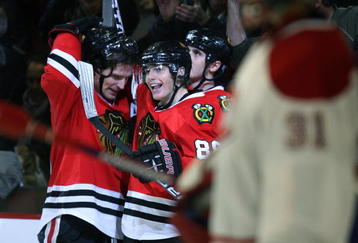 CHICAGO - OCTOBER 30: (L-R) Patrick Sharp #10, Patrick Kane #88 and Dave Bolland #36 of the Chicago Blackhawks celebrate Sharps' winning goal against Carey Price #31 of the Montreal Canadiens at the United Center on October 30, 2009 in Chicago, Illinois. The Blackhawks defeated the Canadiens 3-2. (Photo by Jonathan Daniel/Getty Images)