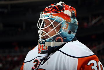 NEWARK, NJ - SEPTEMBER 29:  Dwayne Roloson #30 of the New York Islanders looks on against the New Jersey Devils during their preseason game at the Prudential Center on September 29, 2009 in Newark, New Jersey.  (Photo by Jim McIsaac/Getty Images)