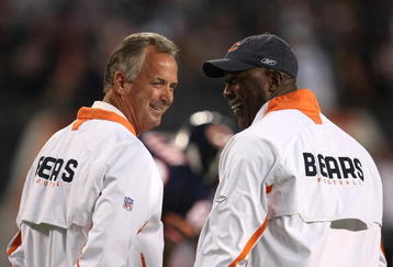 CHICAGO - SEPTEMBER 23:  (L-R) Offensive Coordinator Ron Turner and Head coach Lovie Smith of the Chicago Bears talk on field during pregame against the Dallas Cowboys at Soldier Field on September 23, 2007 in Chicago, Illinois.  (Photo by Jonathan Daniel/Getty Images)
