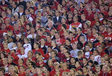 3 Jan 2002:   Nebraska cornhusker fans at attention during the National Anthem during the Rose Bowl National Championship Game versus Miami at the Rose Bowl in Pasadena, California.  Miami won 37-14.  DIGITAL IMAGE    Mandatory Credit:  Stephen Dunn/Getty Images