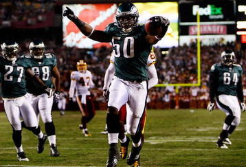 LANDOVER, MD - OCTOBER 26:  Line backer Will Witherspoon #50 of the Philadelphia Eagles crosses the goal line for a touchdown after an interception from quarterback Jason Campbell #17 of the Washington Redskins during the first quarter of the game at FedEx Field October 26, 2009 in Landover, Maryland. The Eagles won the game 27-17.  (Photo by Win McNamee/Getty Images)
