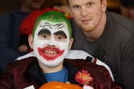 VANVOUVER - OCTOBER 31: In this handout photo Vancouver Canuck forward Daniel Sedin and Dale Knorr show off the pumpkin they carved at Canuck Place October 31, 2005 in Vancouver, Canada. Bertuzzi and other Canuck players spent time with sick children and their families as part of the team's annual visit to the children's hospice.   (Photo by Jeff Vinnick/Vancouver Canucks via Getty Images)