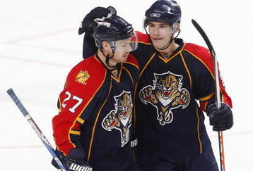 SUNRISE, FL - OCTOBER 16: Rostislav Olesz #85 congratulates Steven Reinprecht #27 of the Florida Panthers after he scored an open net goal against the Philadelphia Flyers late in the third period on October 16, 2009 at the BankAtlantic Center in Sunrise, Florida. (Photo by Joel Auerbach/Getty Images)