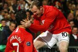MANCHESTER, UNITED KINGDOM - MARCH 11:  Cristiano Ronaldo of Manchester United is congratulated by team mate Wayne Rooney after scoring his team's second goal during the UEFA Champions League Round of Sixteen, Second Leg match between Manchester United and Inter Milan at Old Trafford on March 11, 2009 in Manchester, England.  (Photo by Alex Livesey/Getty Images)