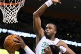 BOSTON, MA - OCTOBER 28: Shelden Williams #13 of the Boston Celtics attempts to block the shot of Gerald Wallace #3 of Charlotte Bobcats at the TD Banknorth Garden on October 28, 2009 in Boston, Massachusetts. NOTE TO USER: User expressly acknowledges and agrees that, by downloading and/or using this Photograph, user is consenting to the terms and conditions of the Getty Images License Agreement. (Photo by Jim Rogash/Getty Images)