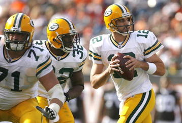 CLEVELAND, OH - OCTOBER 25:  Aaron Rodgers #12 of the Green Bay Packers drops back to pass as he gets protection from Brandon Jackson #32 and Josh Sitton #71 against the Cleveland Browns at Cleveland Browns Stadium on October 25, 2009 in Cleveland, Ohio.  (Photo by Matt Sullivan/Getty Images)