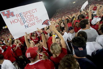 HOUSTON - SEPTEMBER 26:  Cougar fans storm the field after the Houston Cougars defeated the Texas Tech Red Raiders at Robertson Stadium on September 26, 2009 in Houston, Texas.  (Photo by Thomas B. Shea/Getty Images)