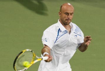 SHANGHAI, CHINA - OCTOBER 15: Ivan Ljubicic of Croatia returns a ball to Gael Monfils of France during day five of 2009 Shanghai ATP Masters 1000 at Qi Zhong Tennis Centre on October 15, 2009 in Shanghai, China.  (Photo by Victor Fraile/Getty Images)