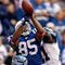INDIANAPOLIS - OCTOBER 04:  Pierre Garcon #85 of the Indianapolis Colts reaches up for the ball while defended by Kelly Jennings #21 of the Seattle Seahawks at Lucas Oil Stadium on October 4, 2009 in Indianapolis, Indiana. The Colts won 34-17.  (Photo by Andy Lyons/Getty Images)