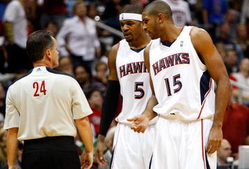 ATLANTA - OCTOBER 28:  Josh Smith #5 and Al Horford #15 of the Atlanta Hawks question a technical foul called against Horford by referee Mike Callahan #24 during the game against the Indiana Pacers at Philips Arena on October 28, 2009 in Atlanta, Georgia.  (Photo by Kevin C. Cox/Getty Images)