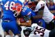 JACKSONVILLE, FL - OCTOBER 31:  Quarterback Tim Tebow #15 of the Florida Gators scores a touchdown against Rennie Curran #35 and Darryl Gamble #50 of the Georgia Bulldogs at Jacksonville Municipal Stadium on October 31, 2009 in Jacksonville, Florida.  (Photo by Kevin C. Cox/Getty Images)