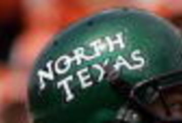 AUSTIN, TX - SEPTEMBER 2:  Quarterback Matt Phillips #18 of the North Texas Eagles drops back to pass against the Texas Longhorns on September 2, 2006 at Texas Memorial Stadium in Austin, Texas. The Longhorns defeated the Eagles 56-7.  (Photo by Ronald Martinez/Getty Images)