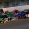 TALLADEGA, AL - OCTOBER 31:  Rick Crawford, driver of the #14 Circle Bar/International Truck Engine Ford, loses control and crashes into Mike Skinner, driver of the #5 PC Miler Navigator Toyota, during the NASCAR Camping World Truck Series Mountain Dew 250 at Talladega Superspeedway on October 31, 2009 in Talladega, Alabama.  (Photo by Sam Greenwood/Getty Images)