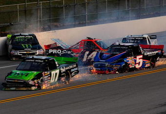 TALLADEGA, AL - OCTOBER 31:  Rick Crawford, driver of the #14 Circle Bar/International Truck Engine Ford, loses control and crashes into Mike Skinner, driver of the #5 PC Miler Navigator Toyota, during the NASCAR Camping World Truck Series Mountain Dew 250 at Talladega Superspeedway on October 31, 2009 in Talladega, Alabama.  (Photo by Sam Greenwood/Getty Images)