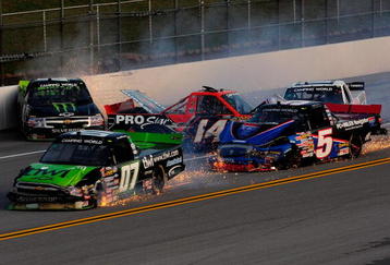 TALLADEGA, AL - OCTOBER 31:  Rick Crawford, driver of the #14 Circle Bar/International Truck Engine Ford, loses control and crashes into Mike Skinner, driver of the #5 PC Miler Navigator Toyota, during the NASCAR Camping World Truck Series Mountain Dew 250 at Talladega Superspeedway on October 31, 2009 in Talladega, Alabama.  (Photo by Sam Greenwood/Getty Images)