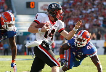 JACKSONVILLE, FL - OCTOBER 31:  Brandon Spikes #51 and Ryan Stamper #41 of the Florida Gators chase after quarterback Joe Cox #14 of the Georgia Bulldogs at Jacksonville Municipal Stadium on October 31, 2009 in Jacksonville, Florida.  (Photo by Kevin C. Cox/Getty Images)