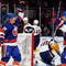 UNIONDALE, NY - OCTOBER 31: Jeff Tambellini #15 of the New York Islanders celebrates his first goal against the Buffalo Sabres with teammate Josh Bailey #12 on October 31, 2009 at Nassau Coliseum in Uniondale, New York. (Photo by Jim McIsaac/Getty Images)
