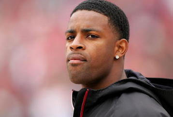 SAN FRANCISCO - OCTOBER 11:  Michael Crabtree, the San Francisco 49ers first round draft pick, watches the 49ers game against the Atlanta Falcons on the sidelines at Candlestick Park on October 11, 2009 in San Francisco, California.  (Photo by Ezra Shaw/Getty Images)