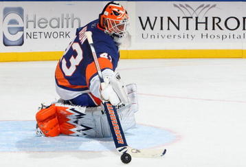 UNIONDALE, NY - OCTOBER 31:  Martin Biron #43 of the New York Islanders makes a save against the Buffalo Sabres on October 31, 2009 at Nassau Coliseum in Uniondale, New York. The Isles defeated the Sabres 5-0 and Biron earned his 200th caree victory.  (Photo by Jim McIsaac/Getty Images)