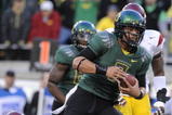 EUGENE, OR - OCTOBER 31:  Quarterback Jeremiah Masoli #8 of the Oregon Ducks breaks the tackle of safety Taylor Mays #2 as he scores a touchdown in the first quarter of the game at Autzen Stadium on October 31, 2009 in Eugene, Oregon. (Photo by Steve Dykes/Getty Images)