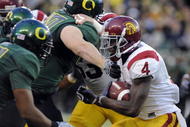 EUGENE, OR - OCTOBER 31: Running back Joe McKnight #4 of the USC Trojans looks for some yardage in the first quarter of the game against the Oregon Ducks at Autzen Stadium on October 31, 2009 in Eugene, Oregon. (Photo by Steve Dykes/Getty Images)