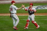 NEW YORK - OCTOBER 28:  (L-R) Cliff Lee #34 and Carlos Ruiz #51 of the Philadelphia Phillies celebrate after their 6-1 win against the New York Yankees in Game One of the 2009 MLB World Series at Yankee Stadium on October 28, 2009 in the Bronx borough of New York City.  (Photo by Jared Wickerham/Getty Images)