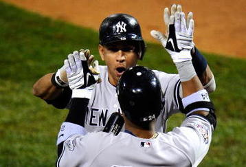 PHILADELPHIA - OCTOBER 31:  Alex Rodriguez #13 of the New York Yankees celebrates his two-run home run with teammate Robinson Cano #24 against the Philadelphia Phillies in Game Three of the 2009 MLB World Series at Citizens Bank Park on October 31, 2009 in Philadelphia, Pennsylvania.  (Photo by Jeff Zelevansky/Getty Images)