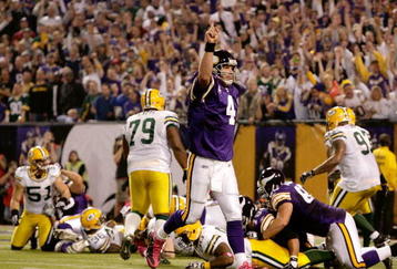 MINNEAPOLIS - OCTOBER 05:  Quarterback Brett Favre #4 of the Minnesota Vikings celebrates after a touchdown during the game against the Green Bay Packers on October 5, 2009 at Hubert H. Humphrey Metrodome in Minneapolis, Minnesota.  (Photo by Jamie Squire/Getty Images)