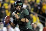 EUGENE, OR - OCTOBER 31: Quarterback Jeremiah Masoli #8 of the Oregon Ducks looks for an open receiver in the third quarter of the game against the USC Trojans at Autzen Stadium on October 31, 2009 in Eugene, Oregon. Masoli threw for 222 yards and a touchdown and ran for 164 more yards with another score as the Ducks upset the Trojans 47-20. (Photo by Steve Dykes/Getty Images)
