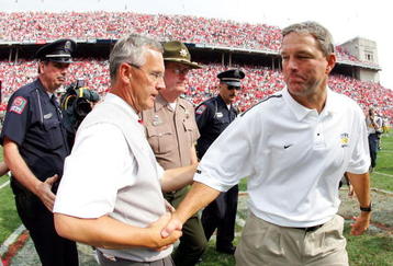 COLUMBUS, OH - SEPTEMBER 24:  Head coach Jim Tressel of Ohio State receives a hand shake from head coach Kirk Ferentz of Iowa after the fourth quarter on September 24, 2005 at Ohio Stadium in Columbus, Ohio. Ohio State defeated Iowa 31-6.  (Photo by Harry How/Getty Images)