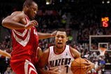 PORTLAND, OR - OCTOBER 27:  Brandon Roy #7 of the Portland Trail Blazers drives against Chuck Hayes #44 of the Houston Rockets during the season opener on October 27, 2009 at the Rose Garden in Portland, Oregon. NOTE TO USER: User expressly acknowledges and agrees that, by downloading and or using this Photograph, user is consenting to the terms and conditions of the Getty Images License Agreement.  (Photo by Jonathan Ferrey/Getty Images)