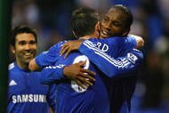 BOLTON, ENGLAND - OCTOBER 31:  Didier Drogba of Chelsea celebrates with Frank Lampard after scoring the fourth goal during the Barclays Premier League match between Bolton Wanderers and Chelsea at the Reebok Stadium on October 31, 2009 in Bolton,United Kingdom.  (Photo by Alex Livesey/Getty Images)