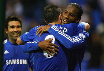 BOLTON, ENGLAND - OCTOBER 31:  Didier Drogba of Chelsea celebrates with Frank Lampard after scoring the fourth goal during the Barclays Premier League match between Bolton Wanderers and Chelsea at the Reebok Stadium on October 31, 2009 in Bolton,United Kingdom.  (Photo by Alex Livesey/Getty Images)